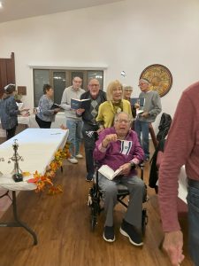 Temple Beth Shalom members celebrating Simchat Torah which is a Jewish holiday that celebrates and marks the conclusion of the annual cycle of public Torah readings, and the beginning of a new cycle.